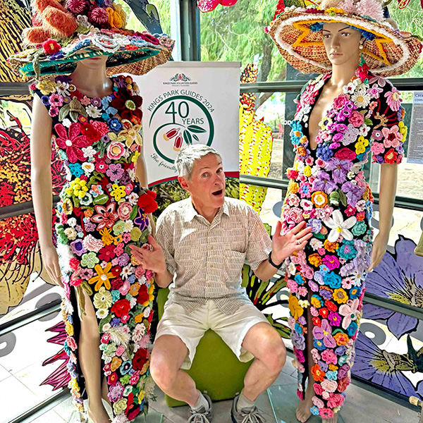 Daniel Sparler with mannequins dressed in flowers